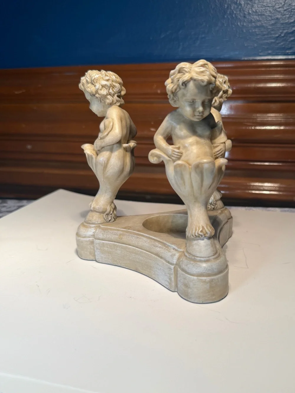 Vintage Resin Cherub Candle Holder features Three Cherubs Popping Out Of Flowers